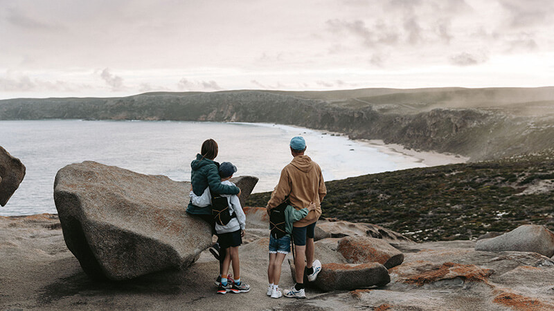 Family looking out from the Remarkable Rocks