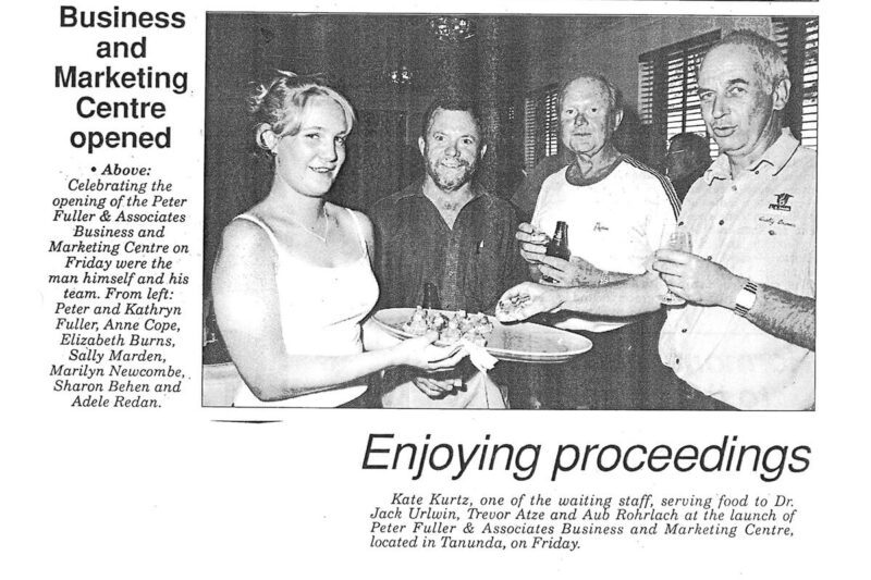 Newspaper clipping picturing guests at a Fuller event in the year 2000