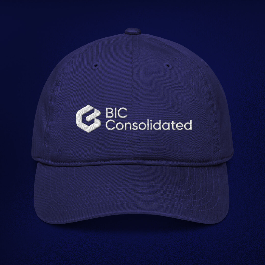 The BIC Consolidated logo embroidered on a navy cap